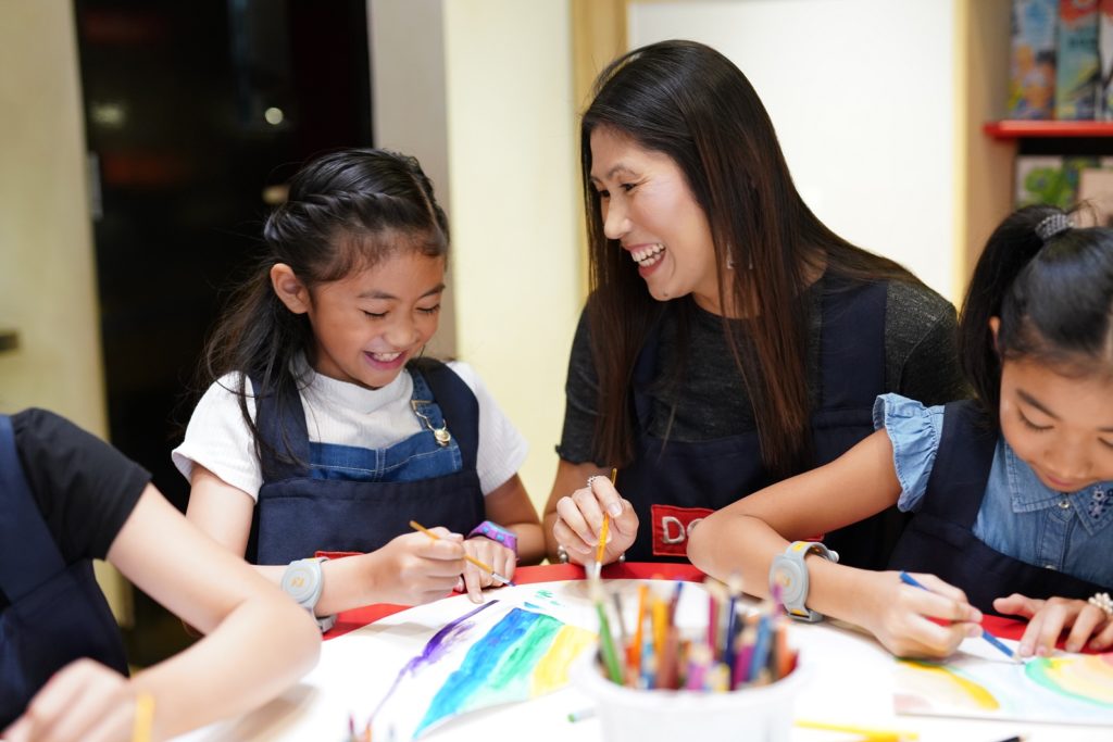 Parents play with kids at KidZania 